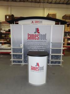 Modified VK-1341 Hybrid Display with Tension Fabric and Direct Print Graphics, Header, Canopy, (7) Shelves, Monitor Mount, (2) LED Stem Lights, and MOD-1267 Locking Counter